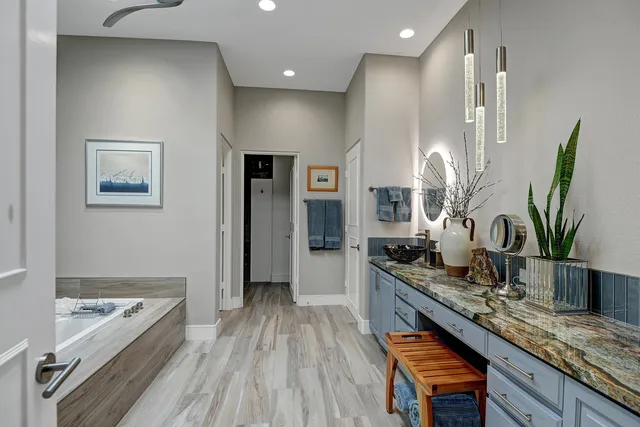 a kitchen with counter top space a sink and stainless steel appliances