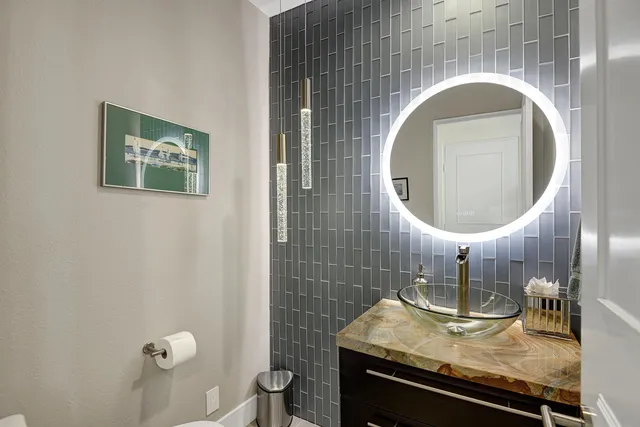 a bathroom with a sink and a mirror