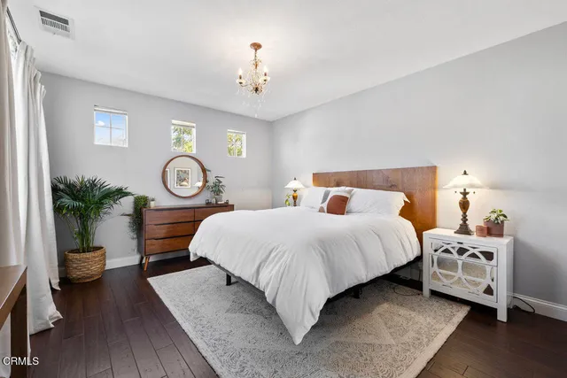 a bed room with a bed and a lamp