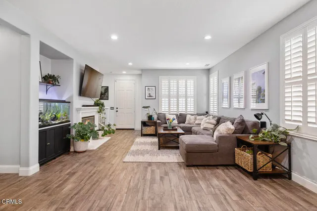 a living room with furniture or couch and a wooden floor