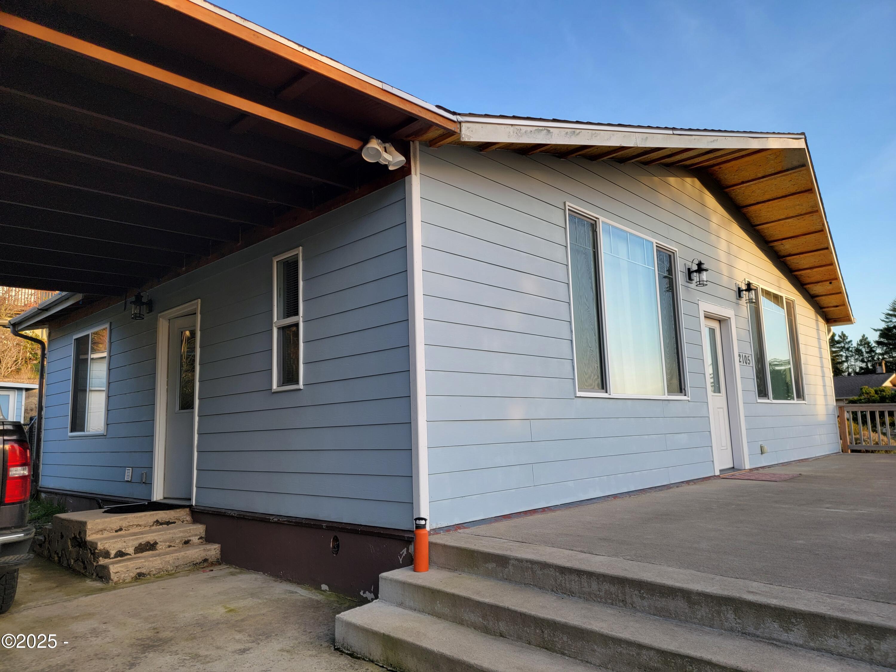 2105 Northwest View Ridge Drive Waldport, OR 97394 - Photo 3 of 12 ba carport and front