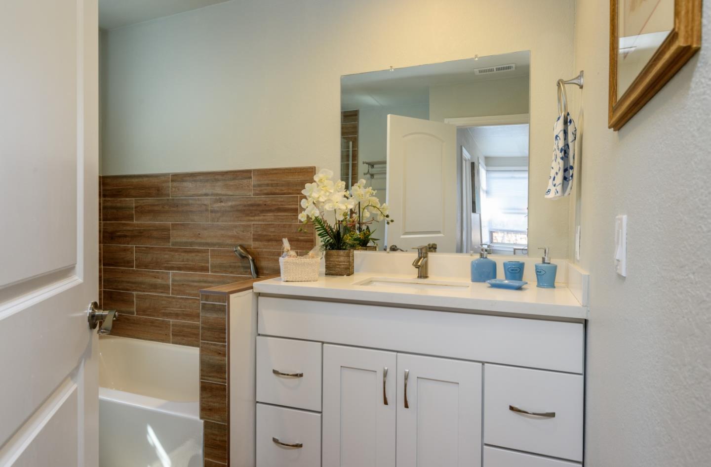 1355 Hillcrest Boulevard Millbrae, CA 94030 - Photo 13 of 17 a bathroom with a sink and a mirror