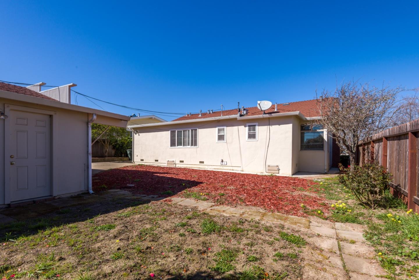 1355 Hillcrest Boulevard Millbrae, CA 94030 - Photo 16 of 17 a front view of a house with a yard and garage
