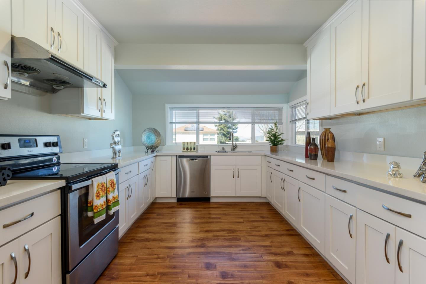 1355 Hillcrest Boulevard Millbrae, CA 94030 - Photo 4 of 17 a kitchen with stainless steel appliances granite countertop a sink and cabinets
