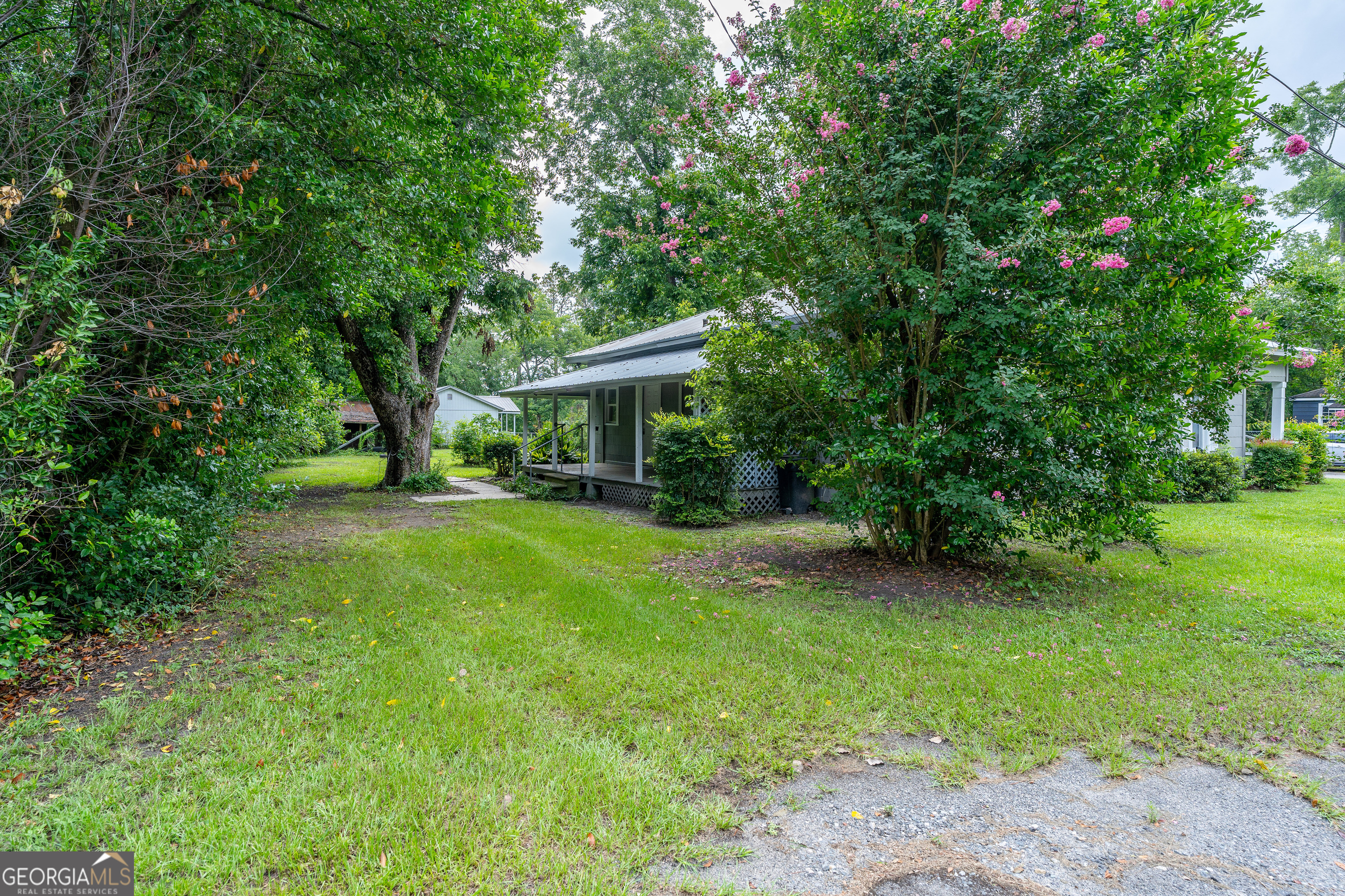 122 Hopkins Street Waycross, GA 31501 - Photo 12 of 31 a view of a house with a yard