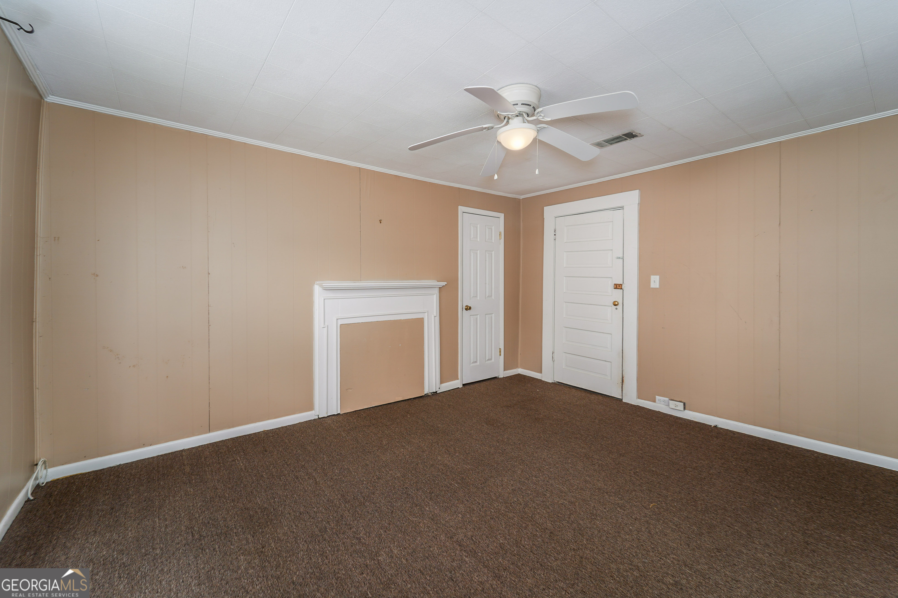 122 Hopkins Street Waycross, GA 31501 - Photo 28 of 31 a view of an empty room and chandelier fan