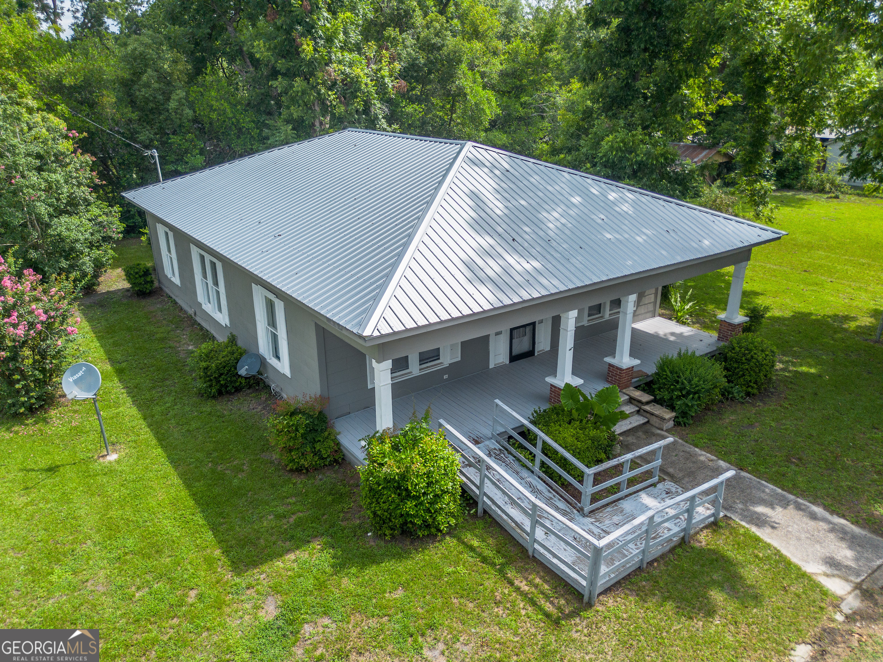 122 Hopkins Street Waycross, GA 31501 - Photo 5 of 31 a aerial view of a house with swimming pool next to a big yard