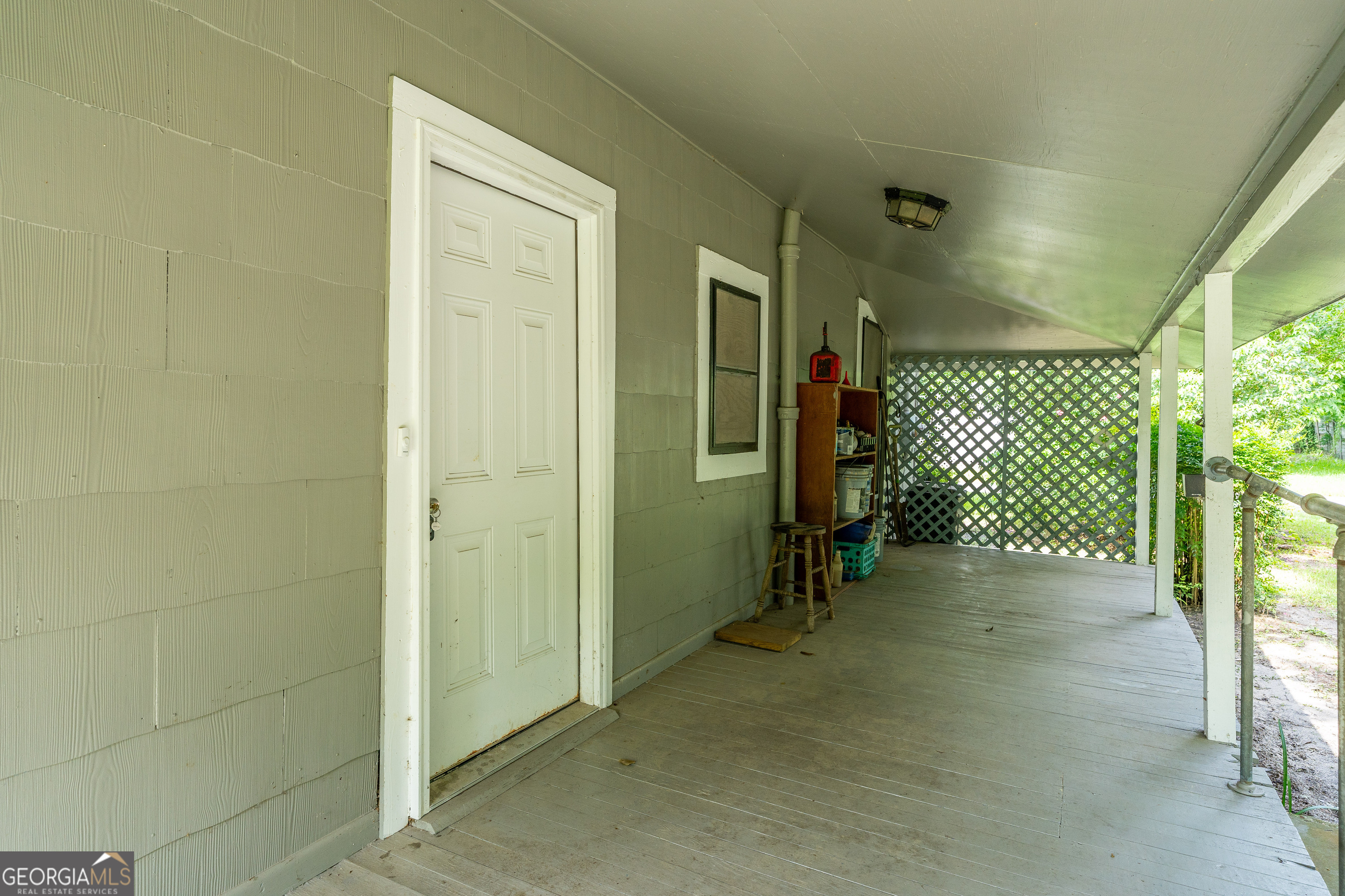 122 Hopkins Street Waycross, GA 31501 - Photo 10 of 31 a view of a room with wooden walls