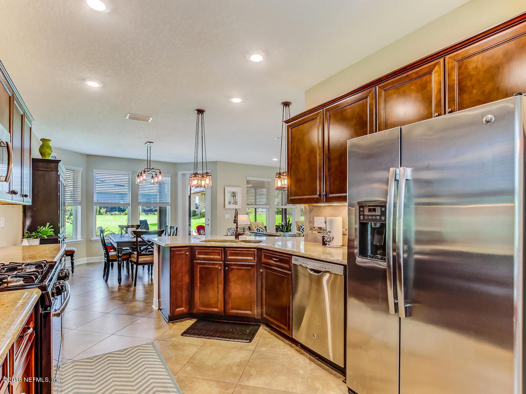 144 Maiden Terrace Ponte Vedra, FL 32081 - Photo 21 of 59 a kitchen with lots of counter top space