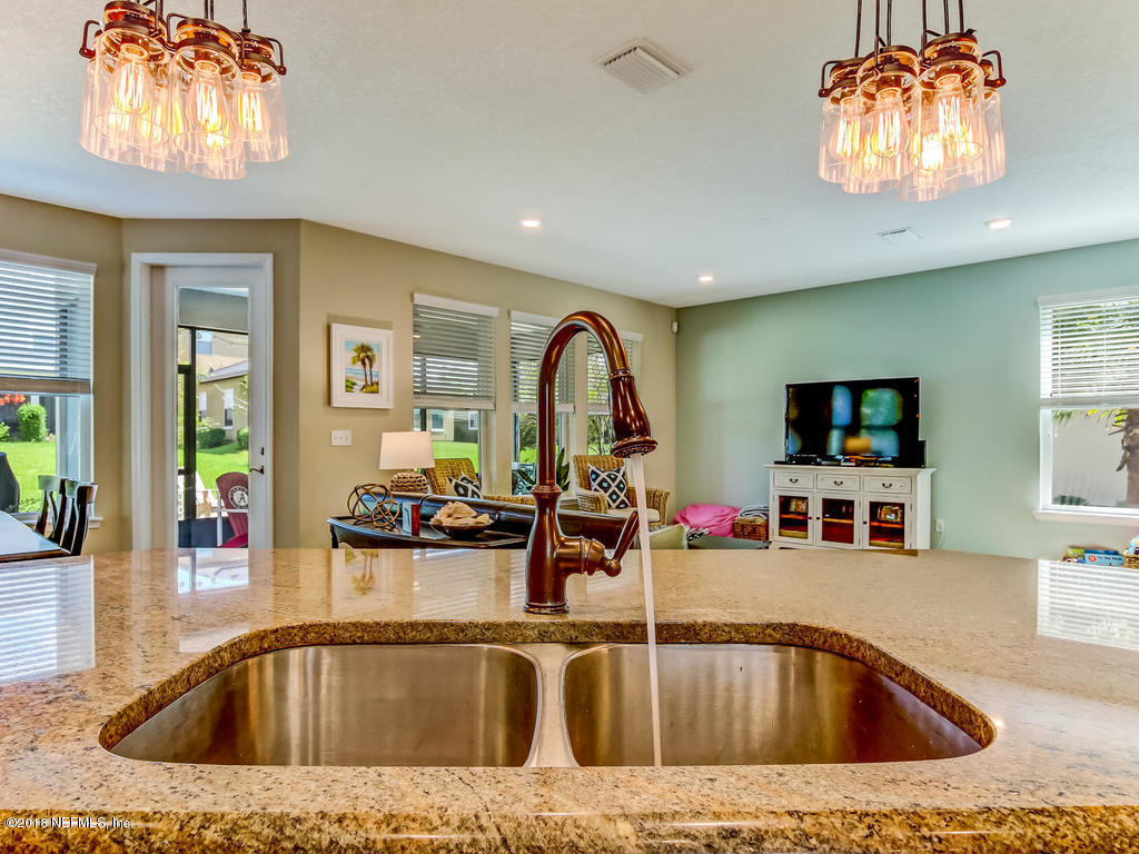 144 Maiden Terrace Ponte Vedra, FL 32081 - Photo 23 of 59 a view of living room with kitchen island stainless steel appliances and living room view