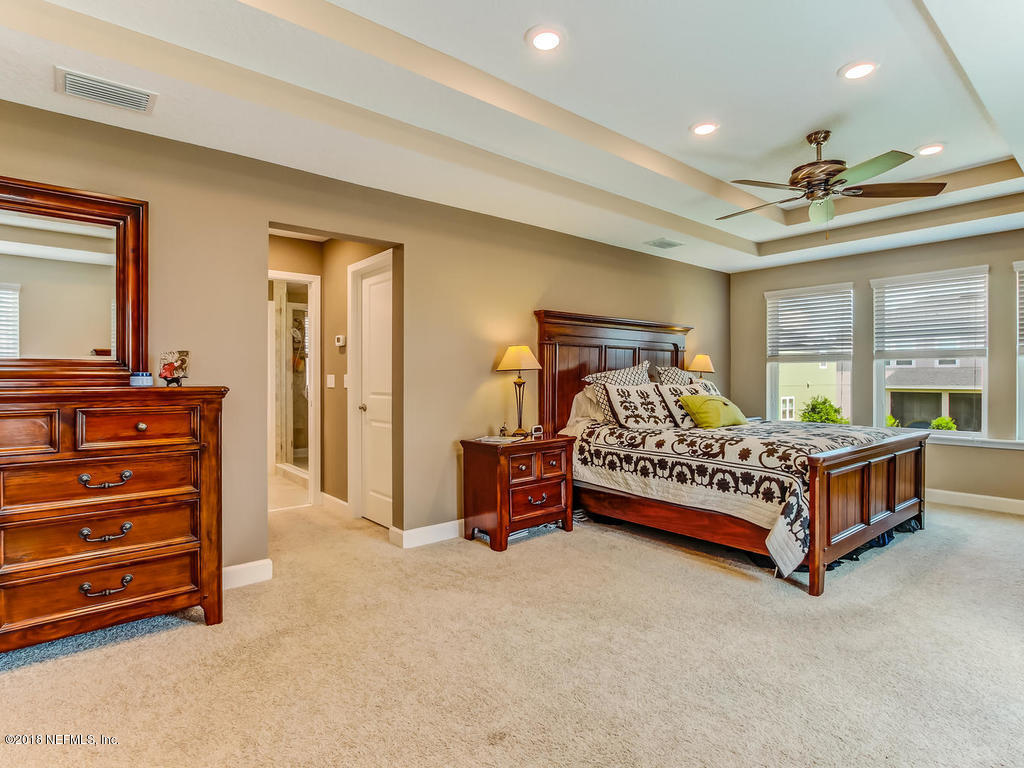 144 Maiden Terrace Ponte Vedra, FL 32081 - Photo 30 of 59 a bedroom with a bed and a dresser