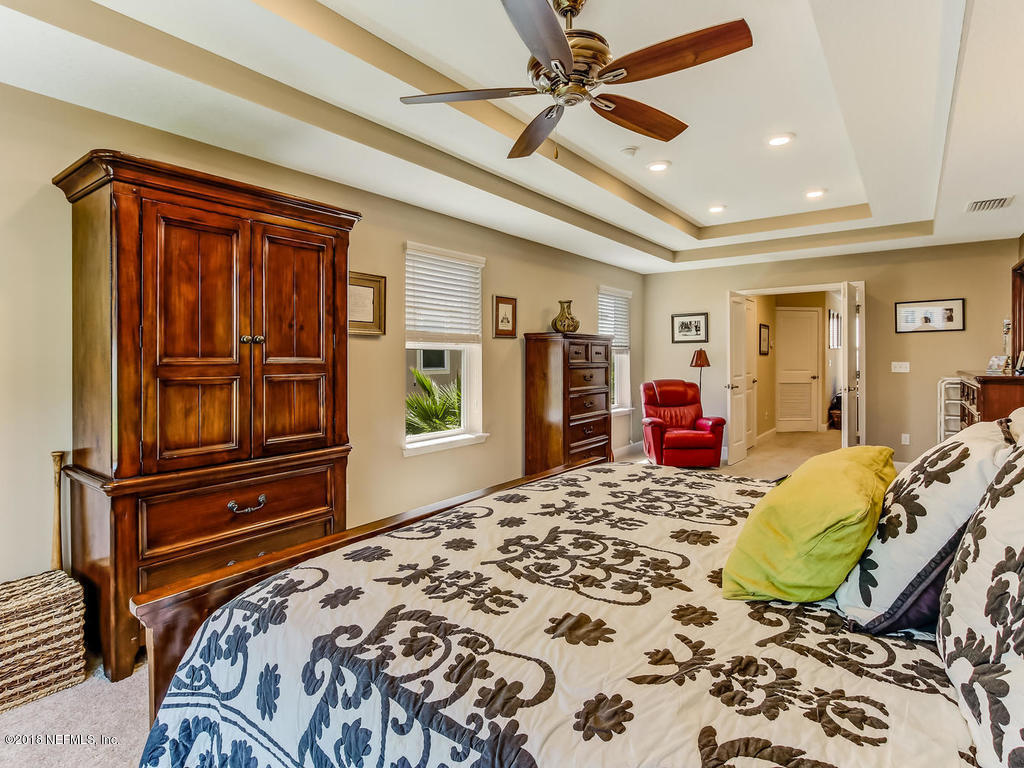 144 Maiden Terrace Ponte Vedra, FL 32081 - Photo 32 of 59 a bedroom with a bed dresser and a window