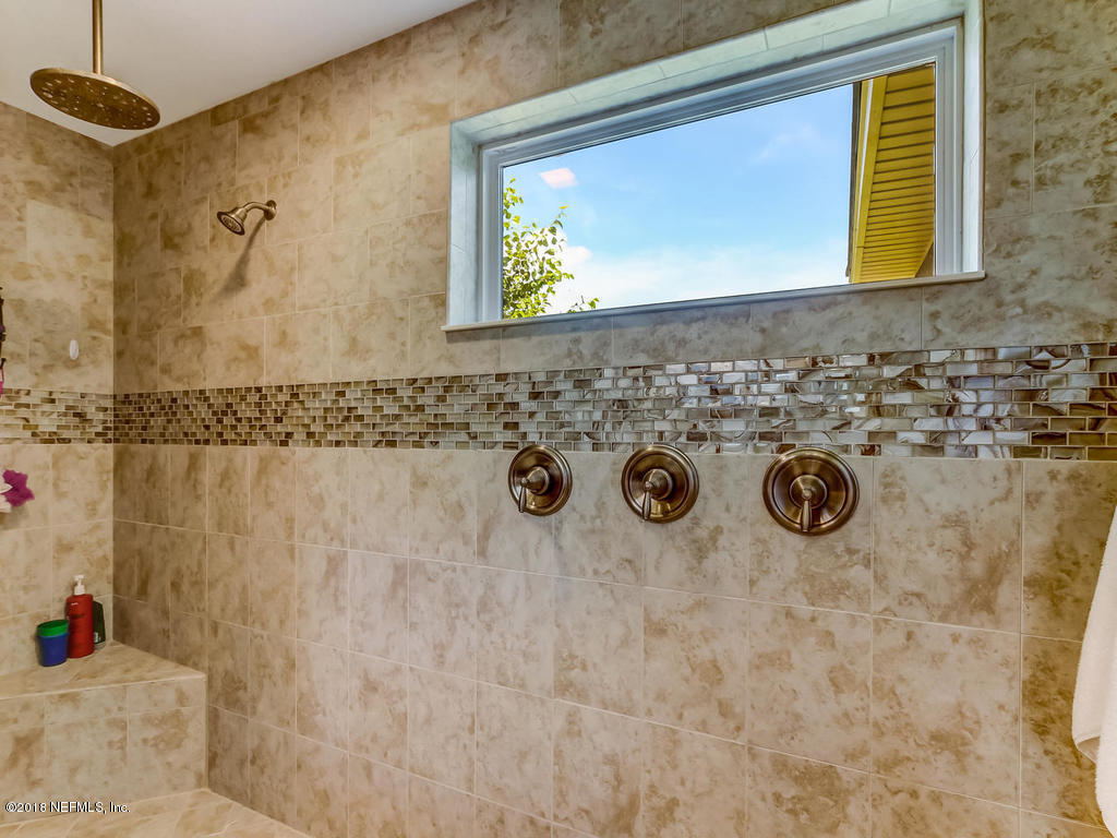 144 Maiden Terrace Ponte Vedra, FL 32081 - Photo 35 of 59 a bathroom with a sink and a mirror