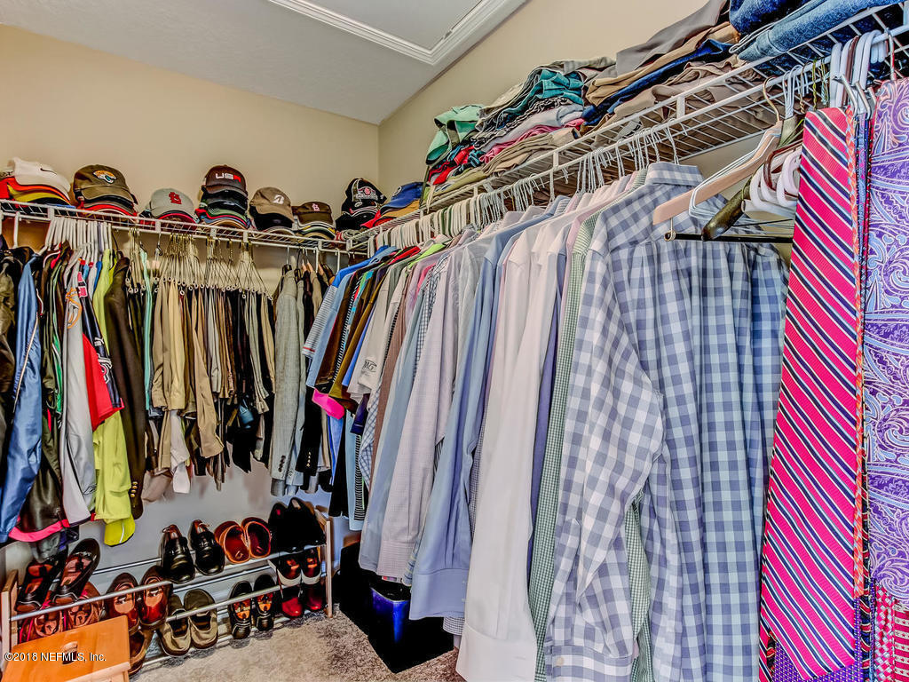 144 Maiden Terrace Ponte Vedra, FL 32081 - Photo 36 of 59 a view of walk in closet with clothes