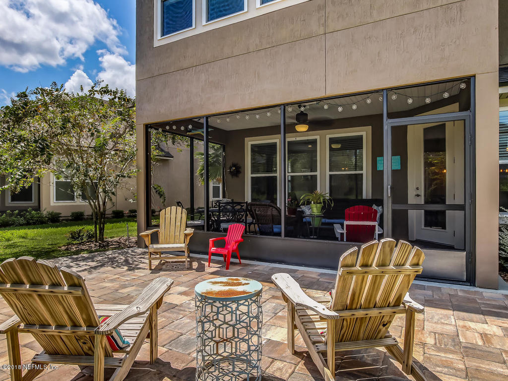 144 Maiden Terrace Ponte Vedra, FL 32081 - Photo 45 of 59 a view of a chairs and table in patio of a backyard