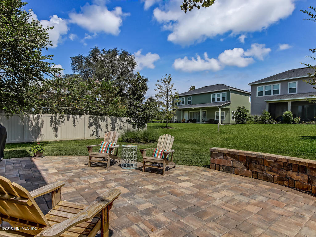144 Maiden Terrace Ponte Vedra, FL 32081 - Photo 46 of 59 a view of a house with backyard sitting area and garden