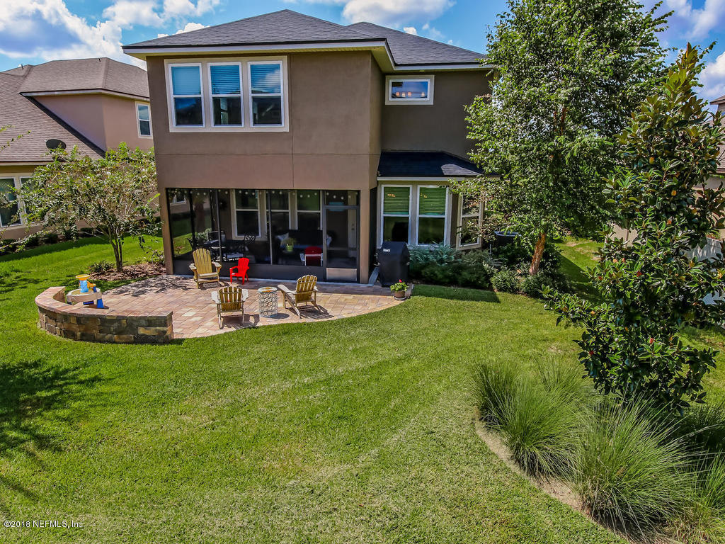 144 Maiden Terrace Ponte Vedra, FL 32081 - Photo 50 of 59 a view of a house with backyard sitting area and garden