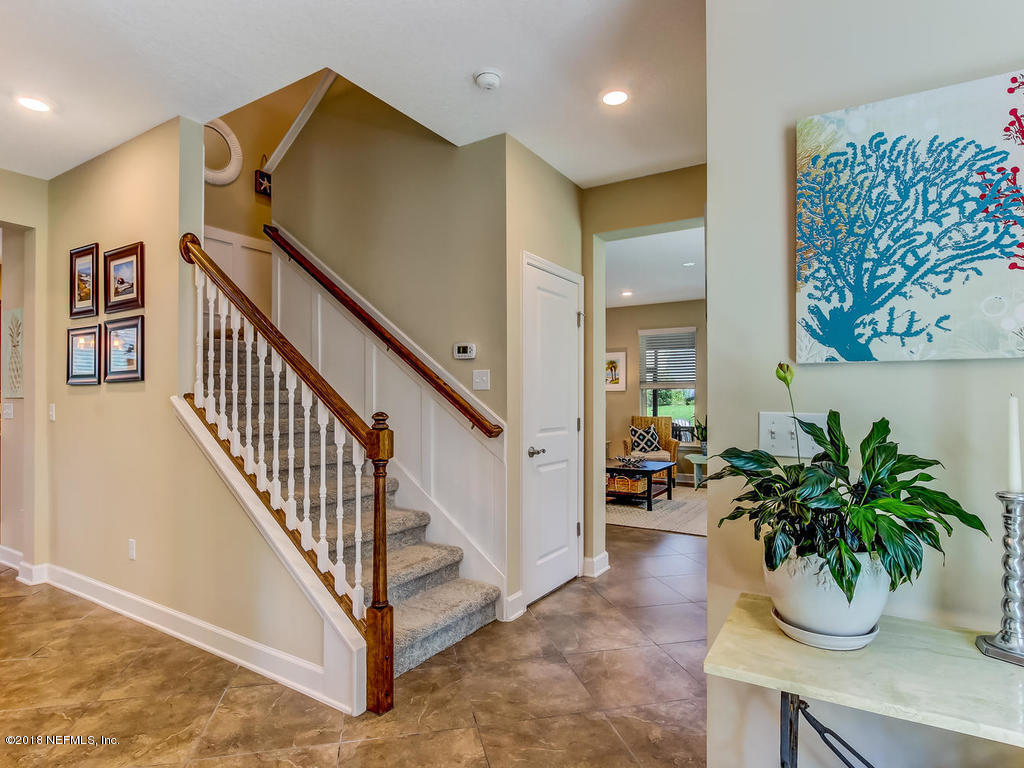 144 Maiden Terrace Ponte Vedra, FL 32081 - Photo 6 of 59 a view of entryway and hall with wooden floor