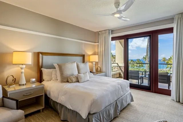a city view from a balcony with a potted plant
