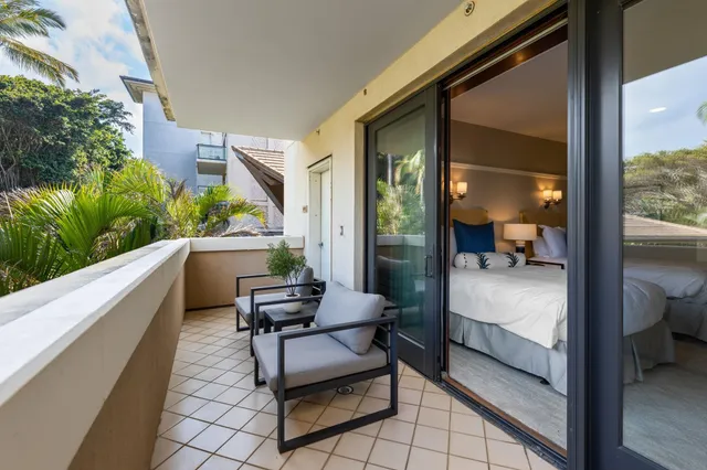 a view of balcony with furniture
