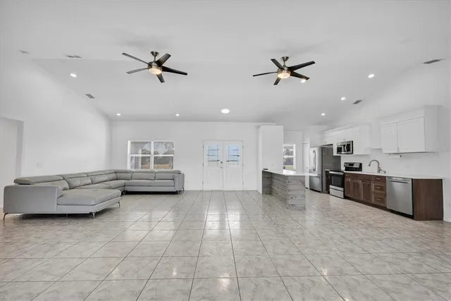a kitchen with cabinets appliances and a sink