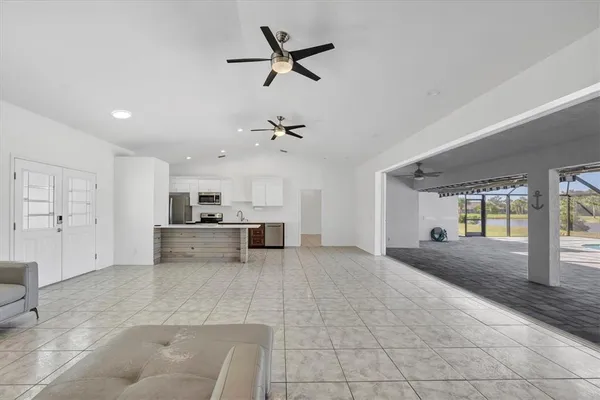 a kitchen with stainless steel appliances granite countertop a sink counter space cabinets and a stove