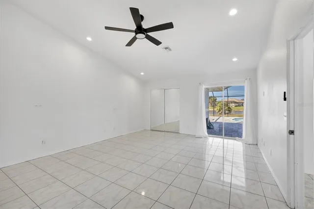 a view of a swimming pool with a patio