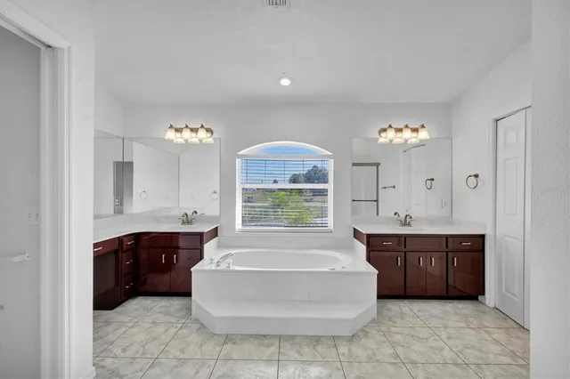 a view of a patio with table and chairs potted plants with wooden floor