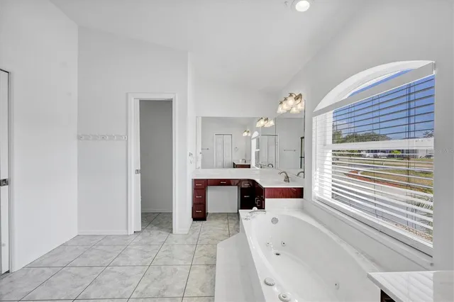 a living room with furniture large window and outer view