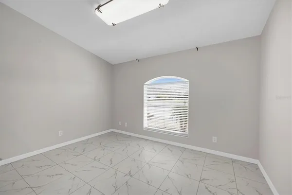 a kitchen with a refrigerator and a stove top oven