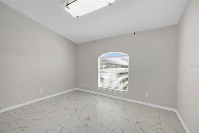 a living room with furniture and a ceiling fan