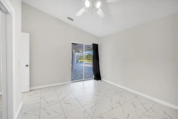 a bedroom with a bed and chair