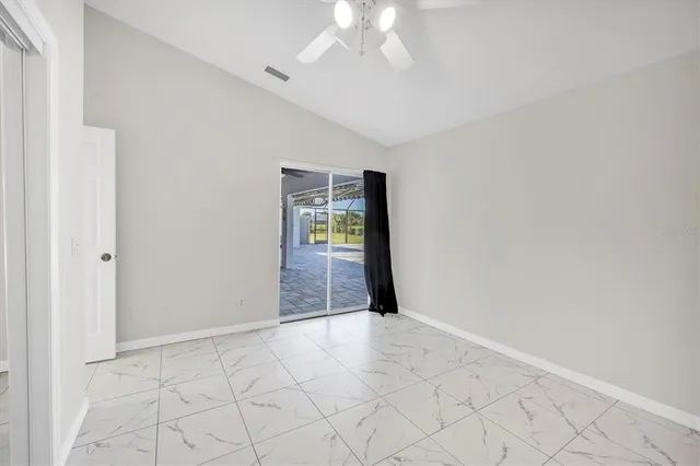 a kitchen with a sink a stove and cabinets