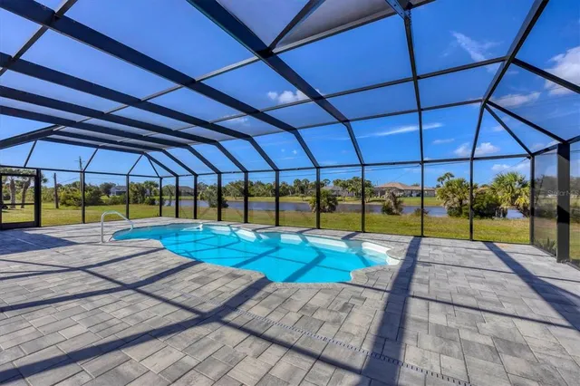 a kitchen with a refrigerator and a stove top oven