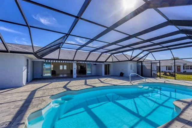 a bedroom with a bed and chair