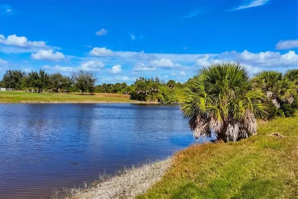 a bathroom with a sink mirror vanity and toilet