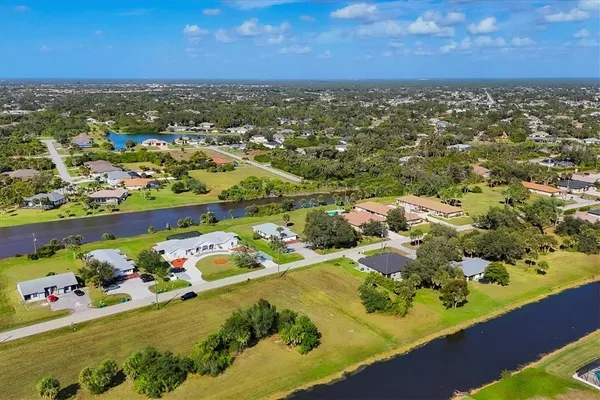 a view of a lake with a house in the background