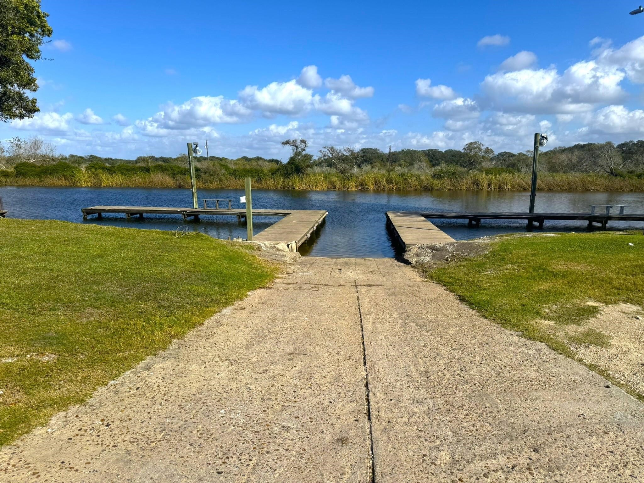 93 Swallow Street Palacios, TX 77465 - Photo 21 of 25 a view of a lake with houses