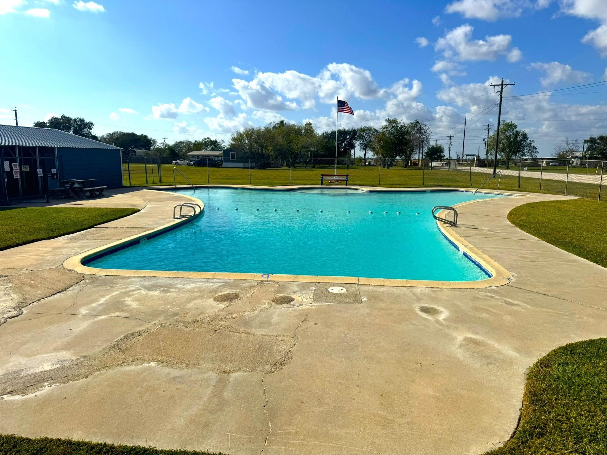93 Swallow Street Palacios, TX 77465 - Photo 25 of 25 a view of outdoor space swimming pool and lake view