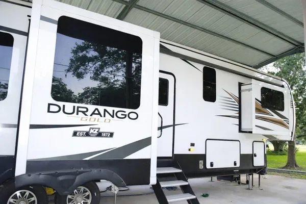 a view of a living room with a flat screen tv and couches