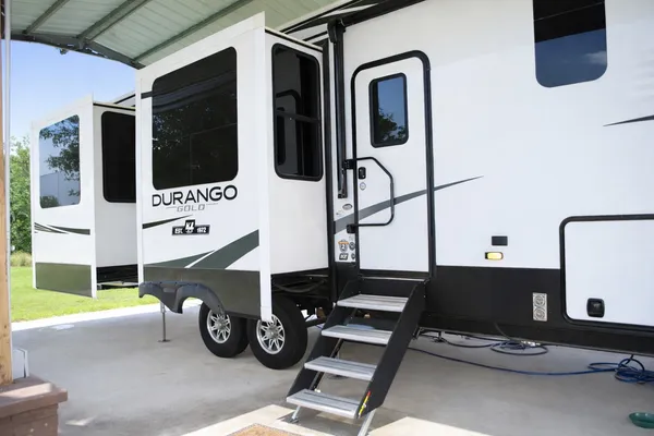 a car parked in front of a white building