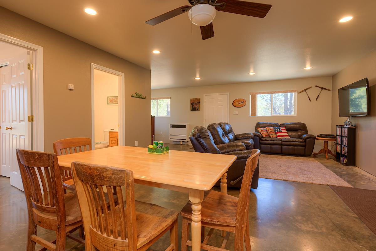 179 Elams Ranch Road Oroville, CA 95966 - Photo 11 of 52 a view of a dining room with furniture and wooden floor