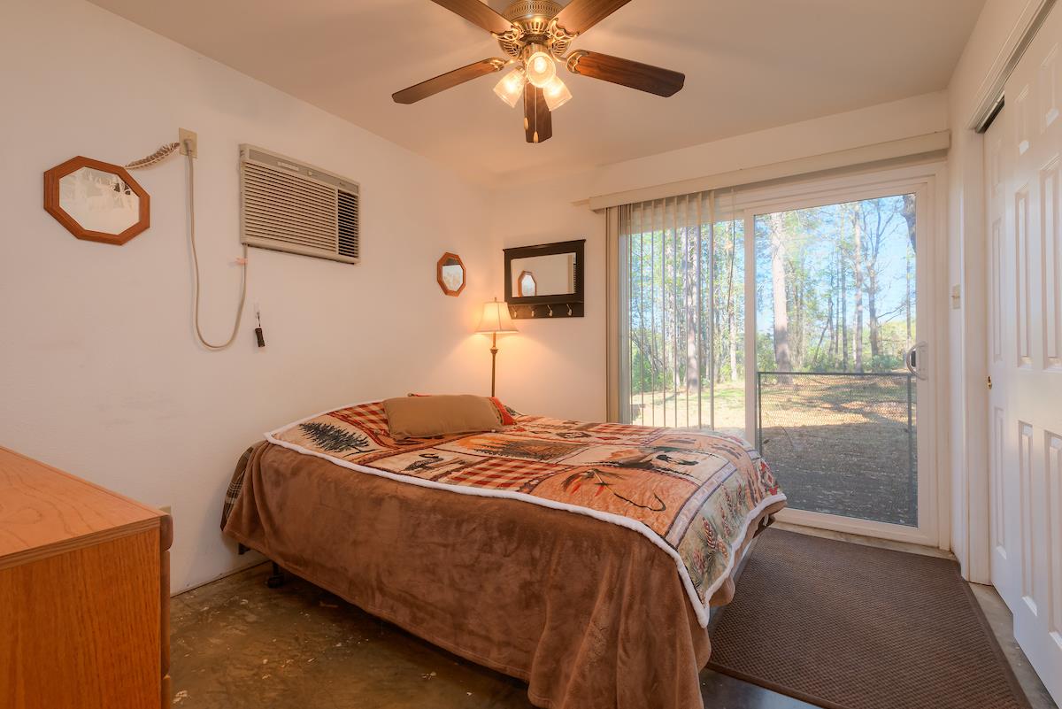 179 Elams Ranch Road Oroville, CA 95966 - Photo 12 of 52 a bedroom with a bed and window