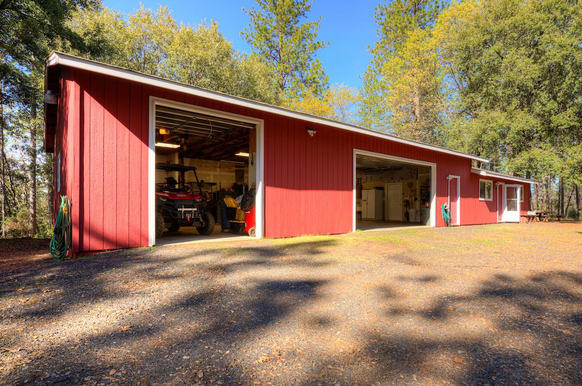 179 Elams Ranch Road Oroville, CA 95966 - Photo 19 of 52 a view of a house with a garage and yard