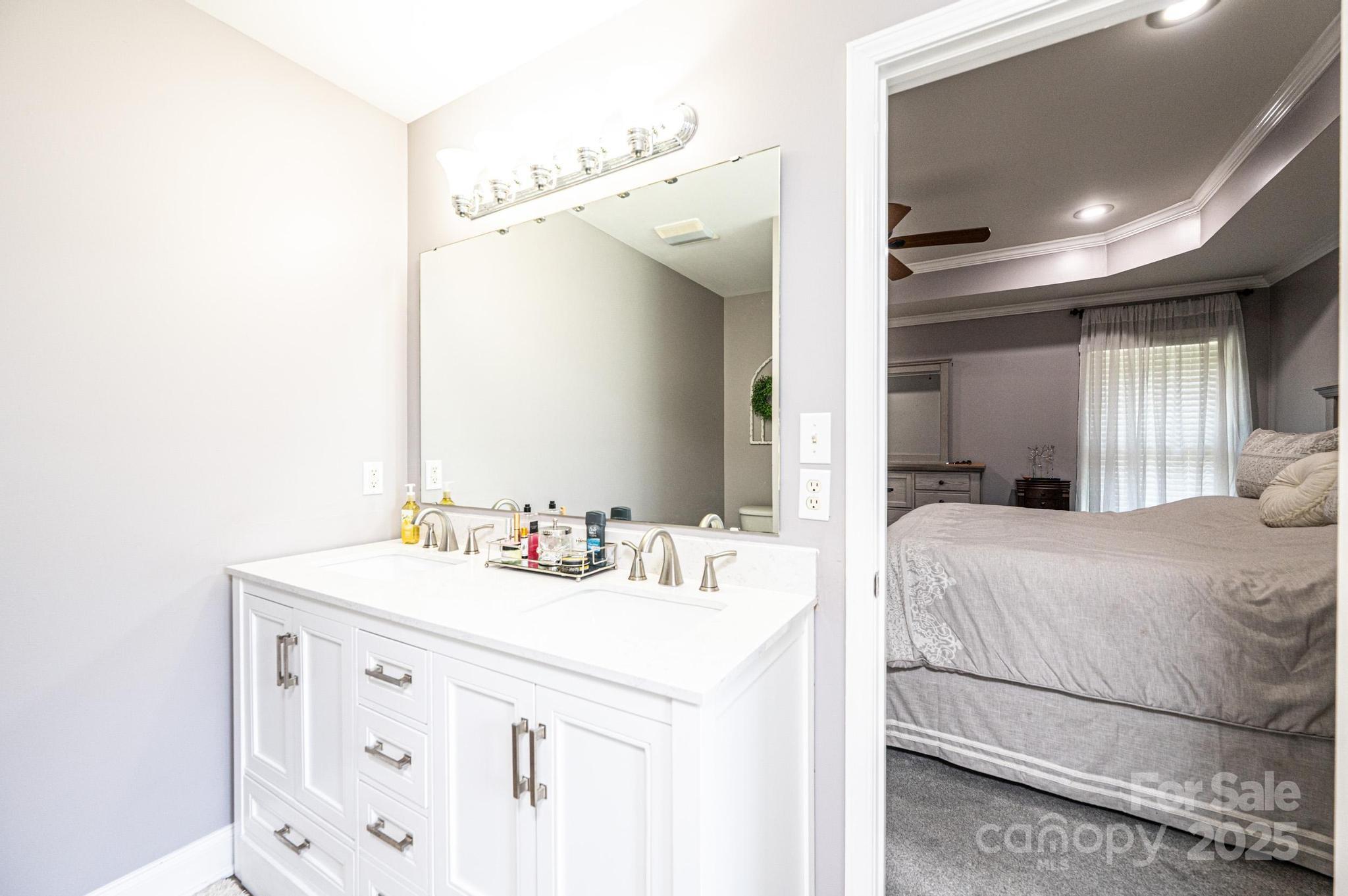 1784 New Star Drive Newton, NC 28658 - Photo 17 of 27 a en suite bathroom with a double vanity sink and mirror