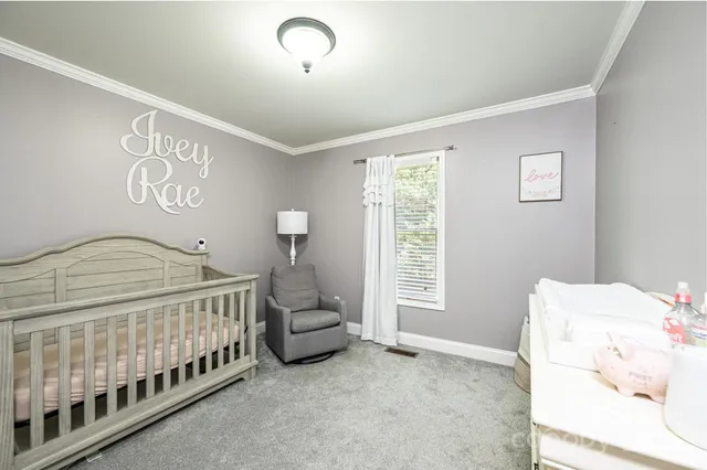 a bedroom with windows