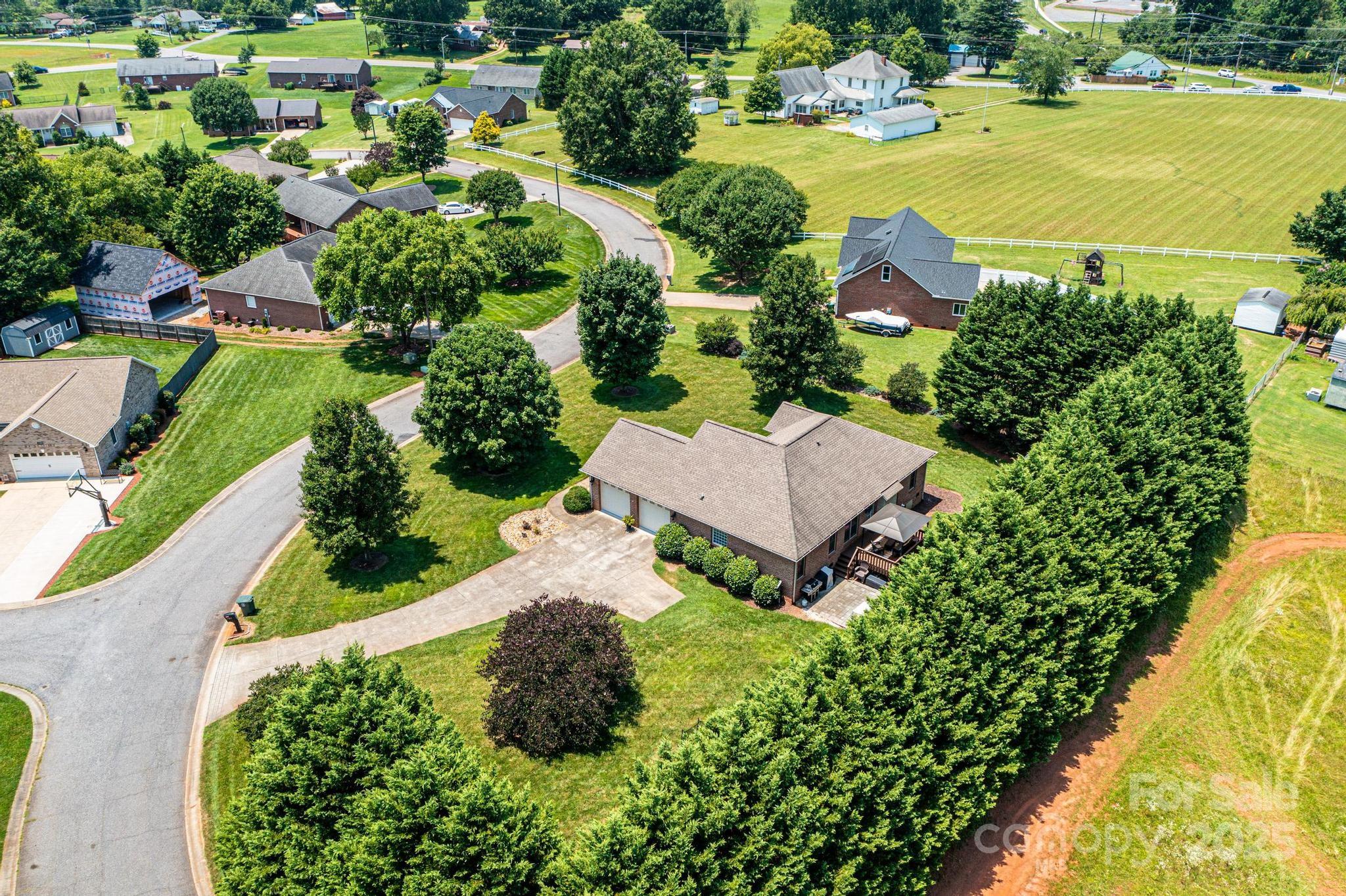 1784 New Star Drive Newton, NC 28658 - Photo 26 of 27 an aerial view of a house with a garden and lake view