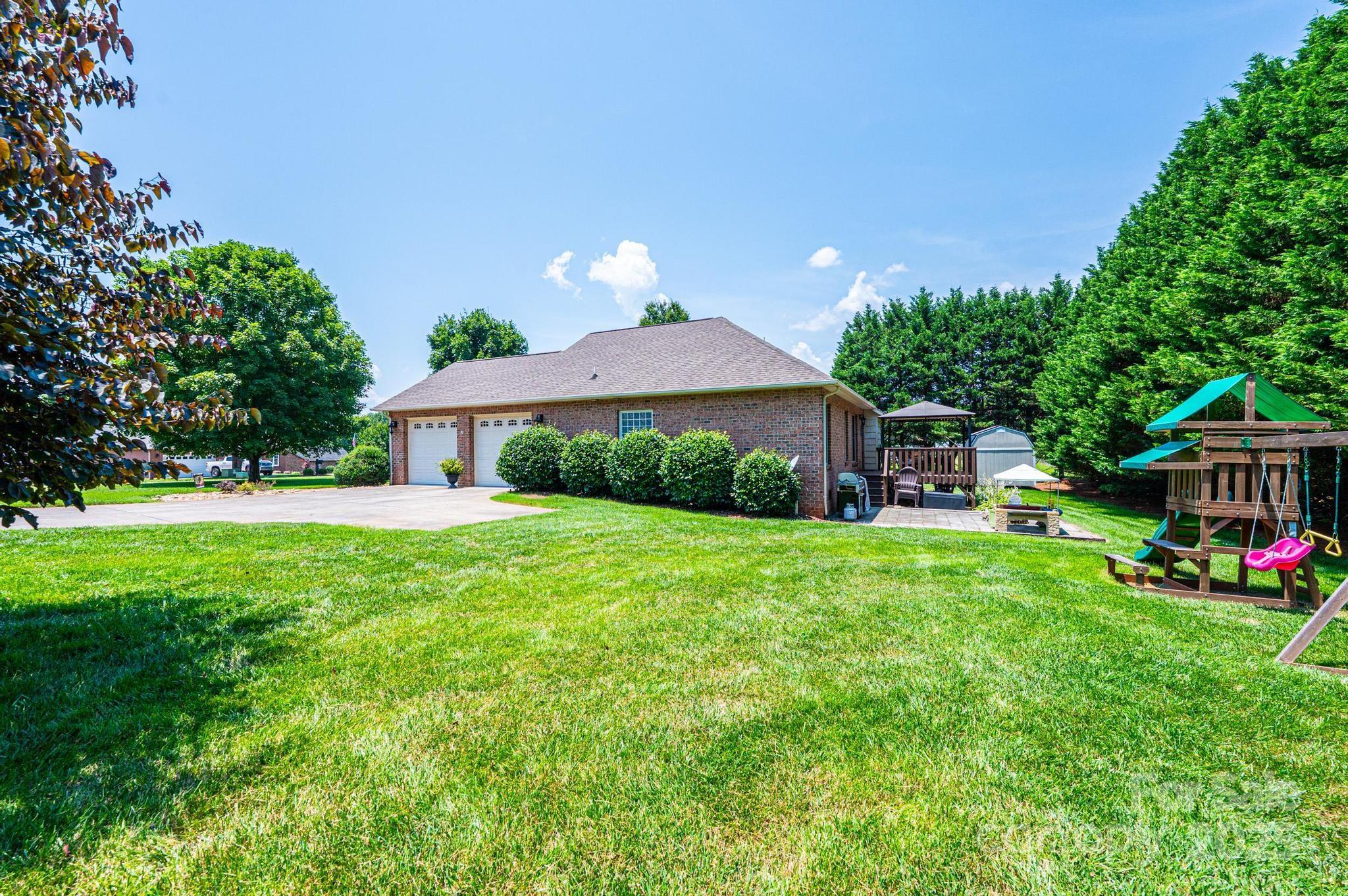 1784 New Star Drive Newton, NC 28658 - Photo 3 of 27 a front view of a house with garden