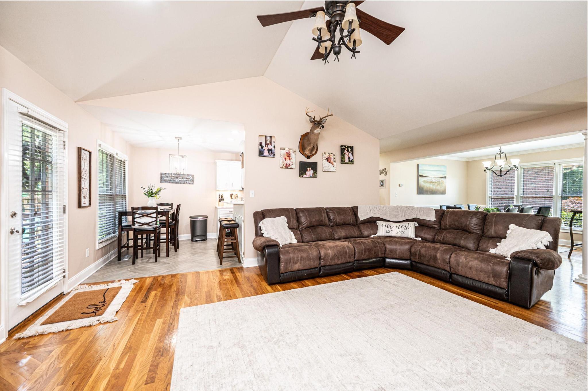 1784 New Star Drive Newton, NC 28658 - Photo 4 of 27 a living room with furniture and a dining table with wooden floor