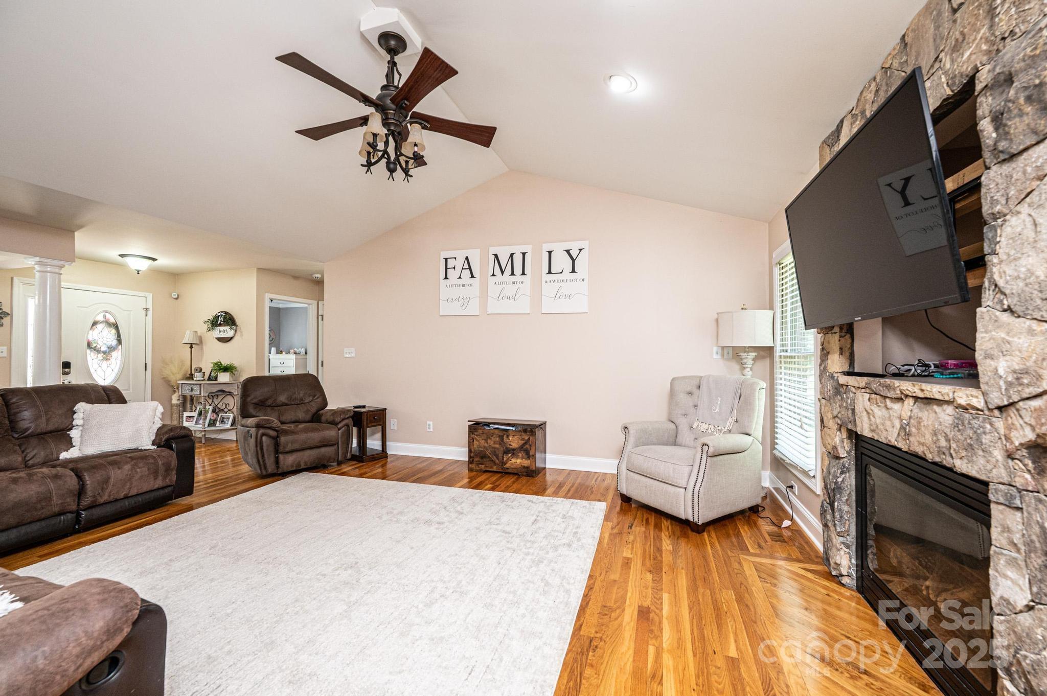 1784 New Star Drive Newton, NC 28658 - Photo 7 of 27 a living room with furniture fireplace and flat screen tv